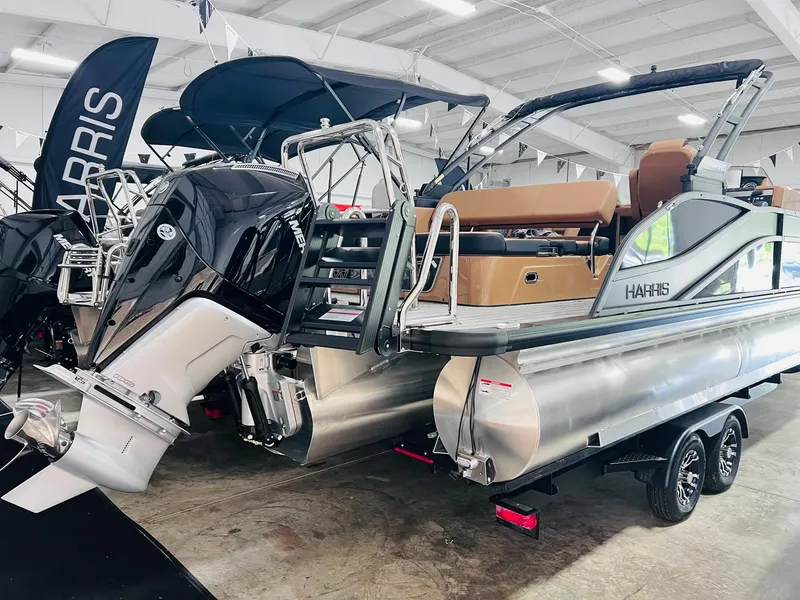 Slide: The Image of 2025 Harris Grand Mariner 230 pontoon boat with powerful outboard motor in showroom. - 20