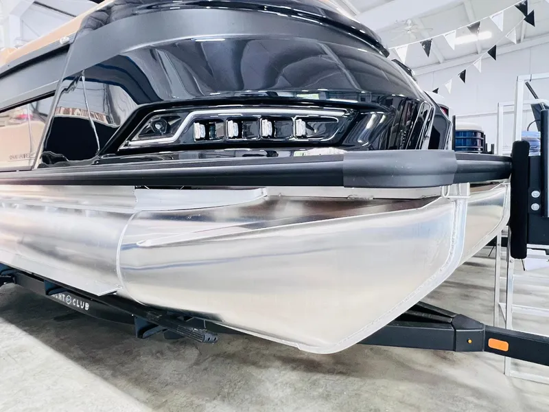 Slide: The Image of 2025 Harris Grand Mariner 230 pontoon boat, sleek design, showcased indoors. - 22