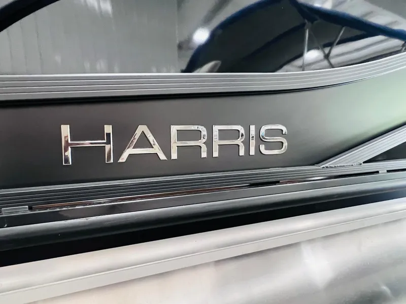Slide: The Image of 2025 Harris Grand Mariner 230 boat logo in sleek metallic design. - 30