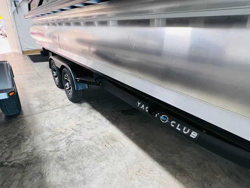 Slide: The Image of 2025 Harris Grand Mariner 230 pontoon boat on Yacht Club trailer in garage. - 35