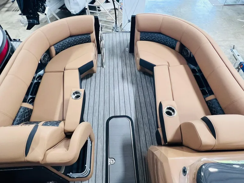 Slide: The Image of 2025 Harris Grand Mariner 230 interior with luxurious tan seating and sleek design. - 7