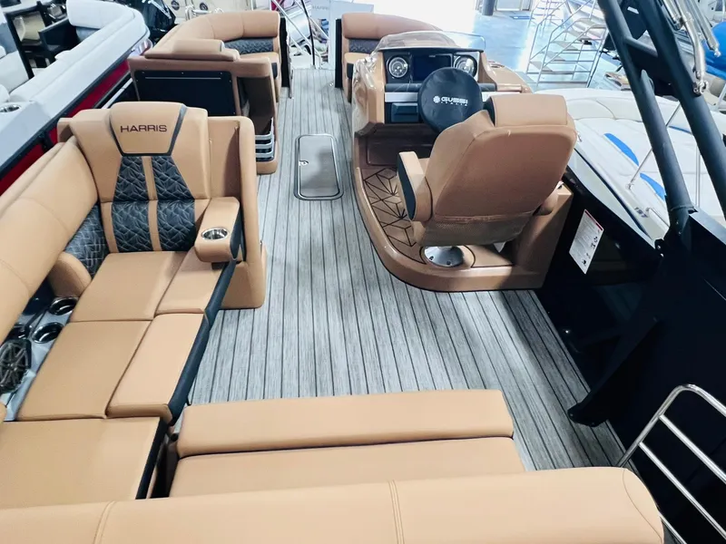 Slide: The Image of Luxurious interior of 2025 Harris Grand Mariner 230 pontoon boat with tan seating. - 9