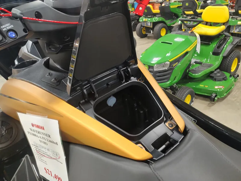Slide: The Image of 2024 Yamaha WaveRunner FX Limited SVHO storage compartment open, displayed in showroom. - 16