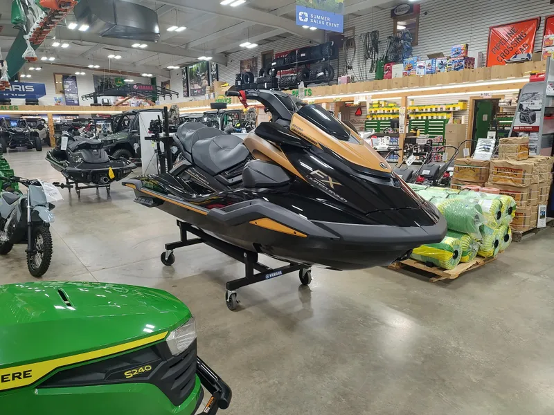Slide: The Image of 2024 Yamaha WaveRunner FX Limited SVHO displayed in a showroom with other vehicles. - 6