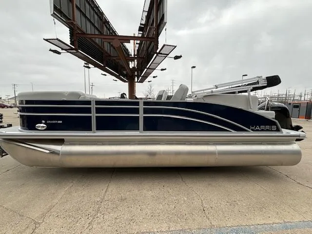 Slide: The Image of 2024 Harris Cruiser 210 CWDH pontoon boat, side view, docked. - 1