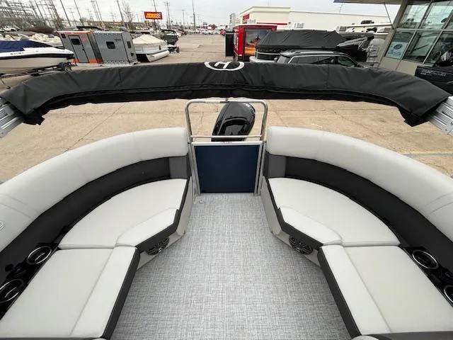 Slide: The Image of 2024 Harris Cruiser 210 CWDH pontoon boat with spacious seating and modern design. - 14