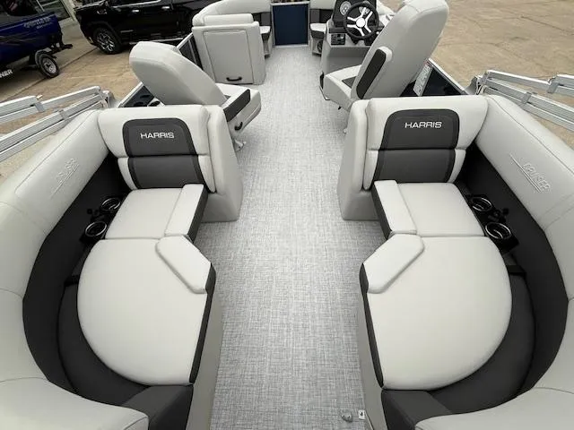 Slide: The Image of 2024 Harris Cruiser 210 CWDH pontoon boat interior with plush seating and modern design. - 15