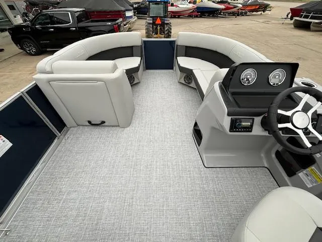 Slide: The Image of 2024 Harris Cruiser 210 CWDH pontoon boat interior with gray flooring and white seating. - 21