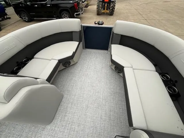 Slide: The Image of 2024 Harris Cruiser 210 CWDH pontoon boat interior with spacious seating and modern design. - 23
