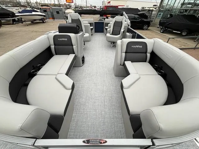 Slide: The Image of 2024 Harris Cruiser 210 CWDH pontoon boat with spacious seating and modern design. - 8