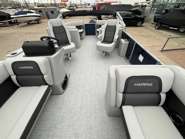 Slide: The Image of 2024 Harris Cruiser 210 CWDH pontoon boat interior with spacious seating and modern design. - 9