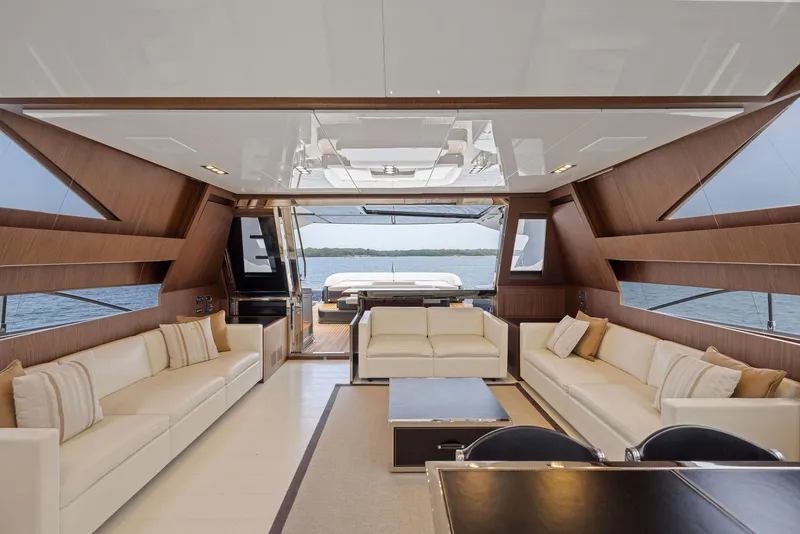 Slide: The Image of Luxurious interior of 2016 Riva 88' Domino Super yacht with elegant seating and panoramic views. - 31