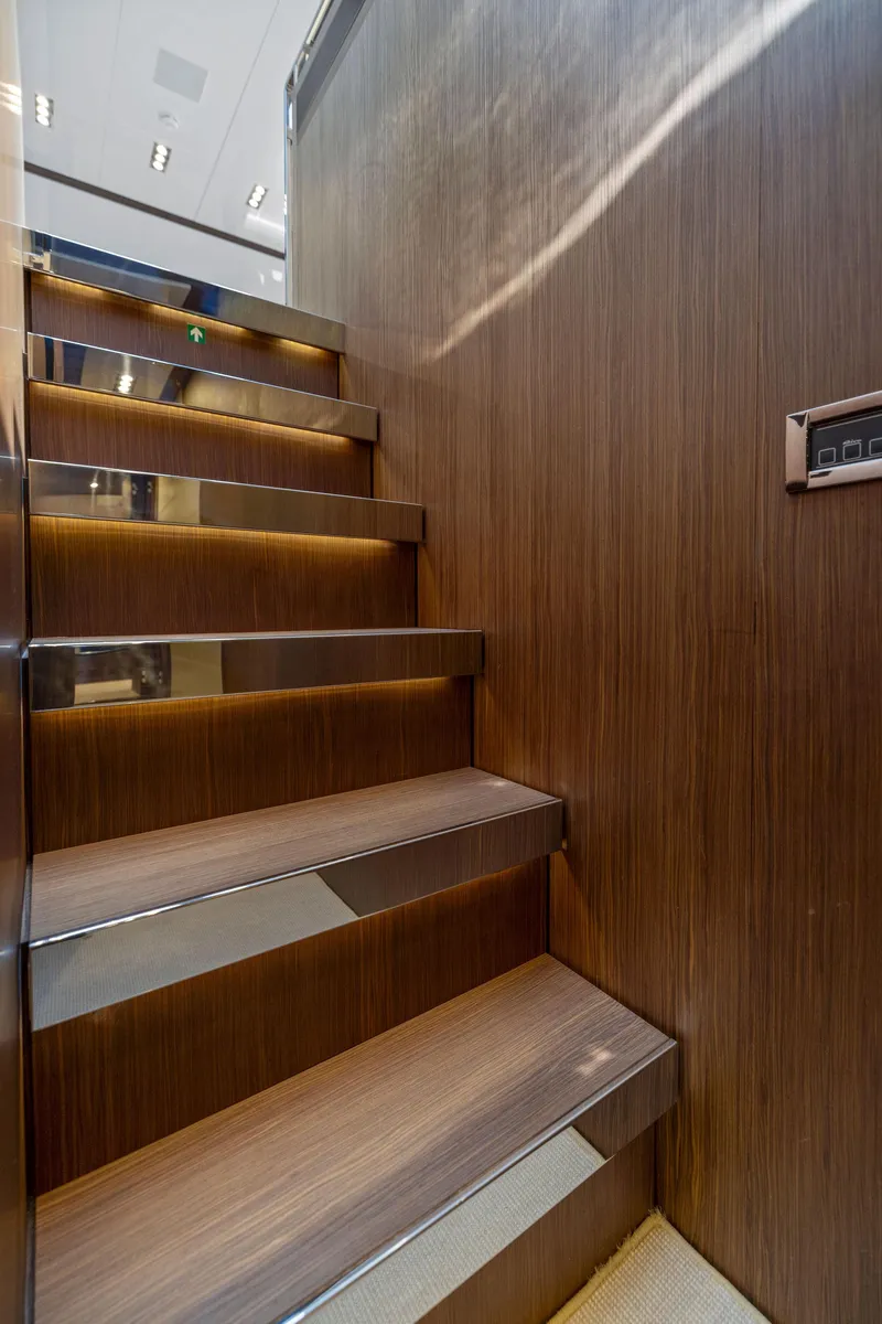 Slide: The Image of Staircase inside 2016 Riva 88' Domino Super yacht with modern wood and metal design. - 47