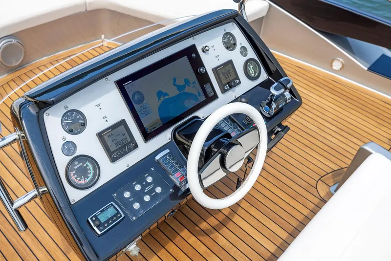 Slide: The Image of Control panel of a 2016 Riva 88' Domino Super yacht with navigation instruments. - 18