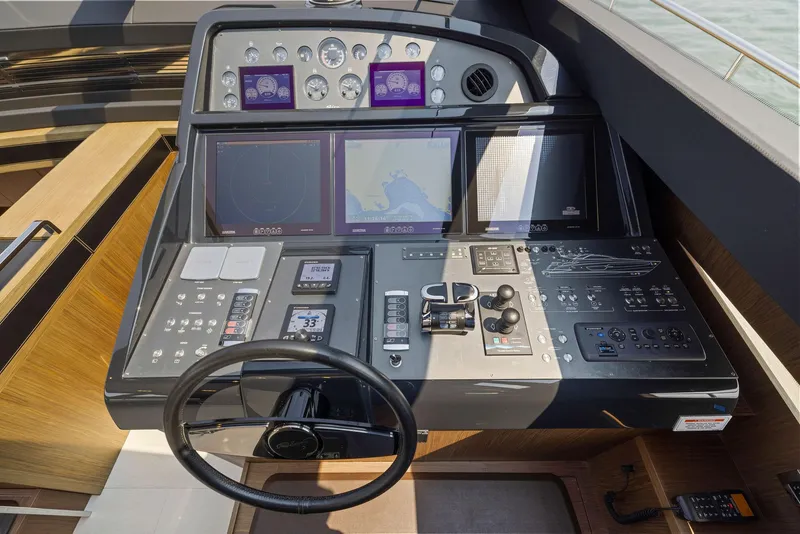 Slide: The Image of Cockpit of 2016 Riva 88' Domino Super yacht with advanced navigation controls. - 39