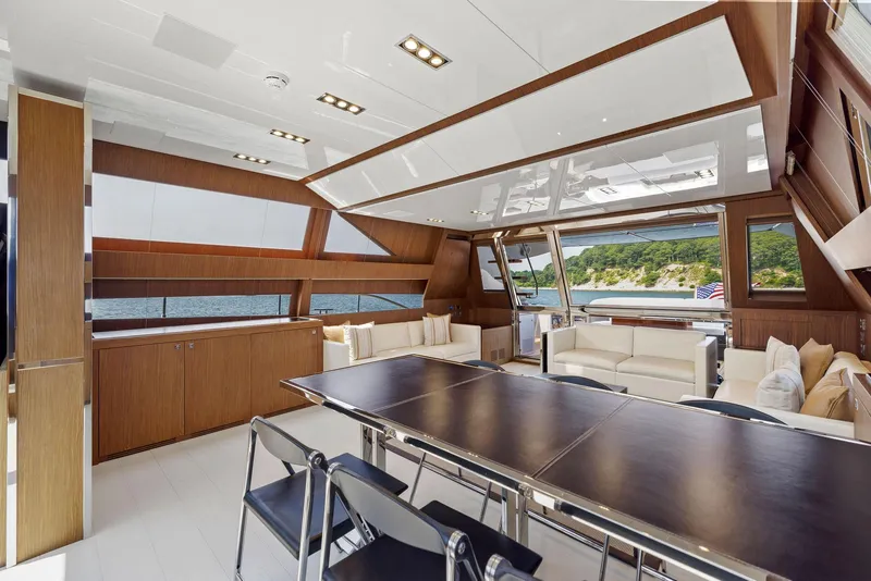 Slide: The Image of Luxurious interior of 2016 Riva 88' Domino Super yacht with modern furnishings and panoramic windows. - 35