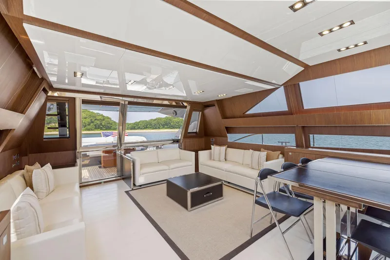 Slide: The Image of Luxurious interior of 2016 Riva 88' Domino Super yacht with modern furnishings and panoramic windows. - 33