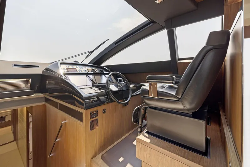 Slide: The Image of Cockpit of 2016 Riva 88' Domino Super yacht with modern controls and leather captain's chair. - 38