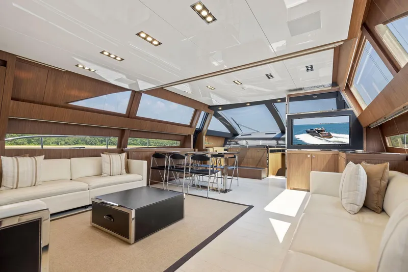 Slide: The Image of Luxurious interior of 2016 Riva 88' Domino Super yacht with modern furnishings and large windows. - 36