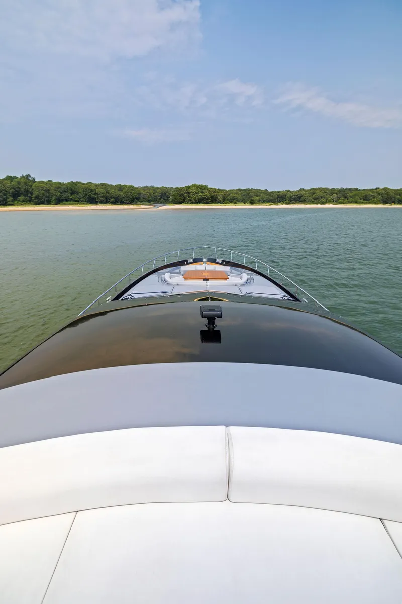 Slide: The Image of 2016 Riva 88' Domino Super yacht cruising on a serene lake. - 17