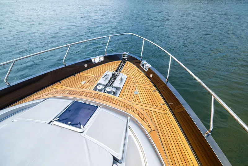 Slide: The Image of Bow of 2016 Riva 88' Domino Super yacht with teak decking and stainless steel railings. - 11