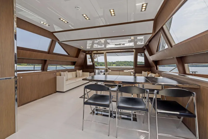 Slide: The Image of Luxurious interior of 2016 Riva 88' Domino Super yacht with modern dining area. - 34