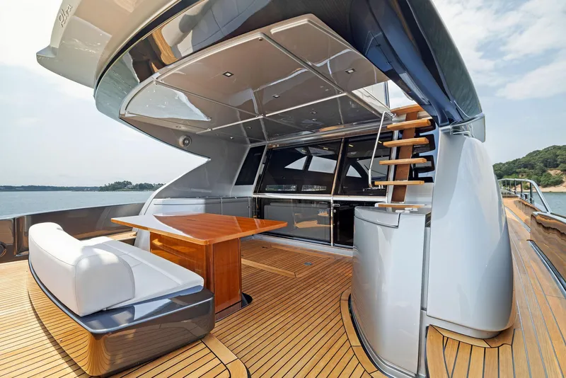 Slide: The Image of Luxury deck of 2016 Riva 88' Domino Super yacht with seating and table. - 27