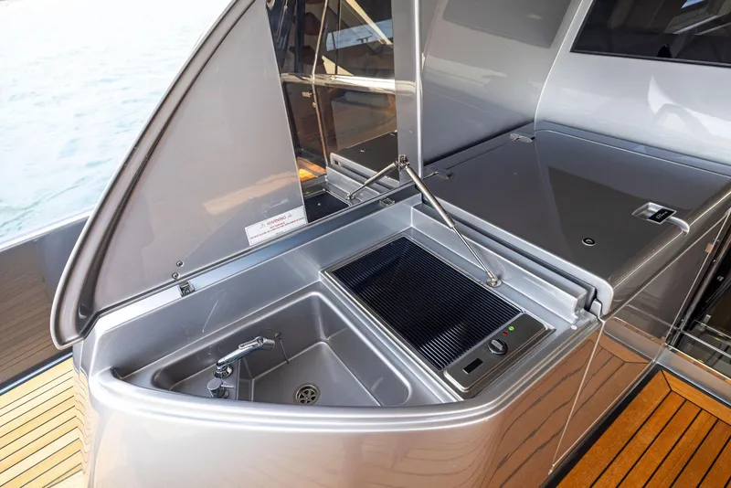 Slide: The Image of Outdoor kitchen area on a 2016 Riva 88' Domino Super yacht. - 24