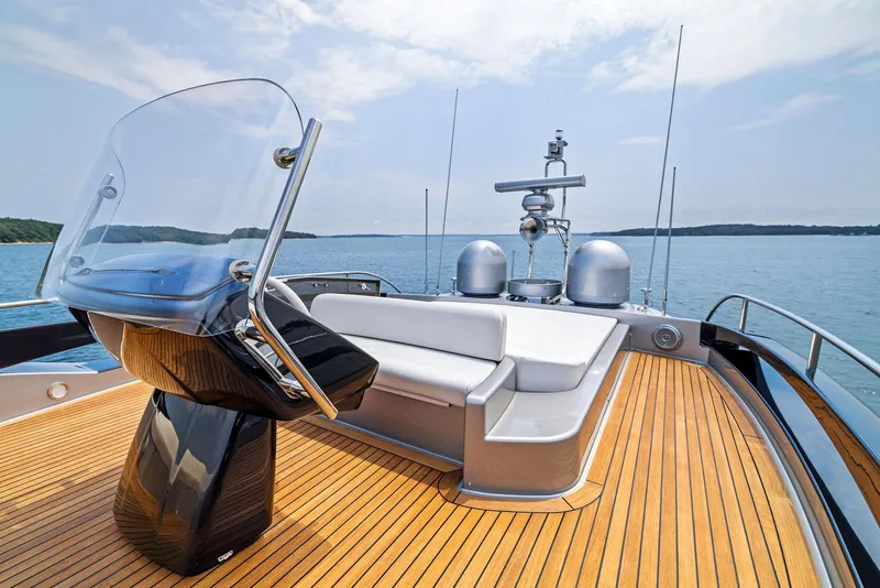 Slide: The Image of Luxury yacht Riva 88' Domino Super 2016, spacious deck with seating and navigation equipment. - 14