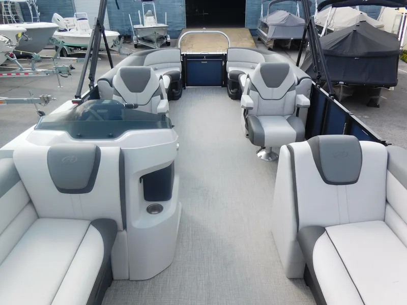 Slide: The Image of 2024 Avalon LSZ Quad Lounger pontoon boat interior with luxurious seating. - 12
