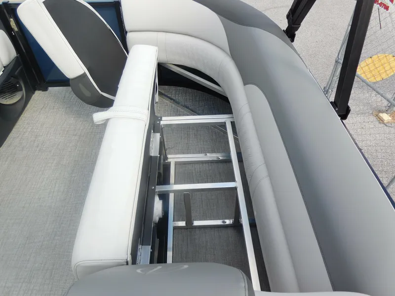 Slide: The Image of 2024 Avalon LSZ Quad Lounger interior seating with storage compartments. - 15