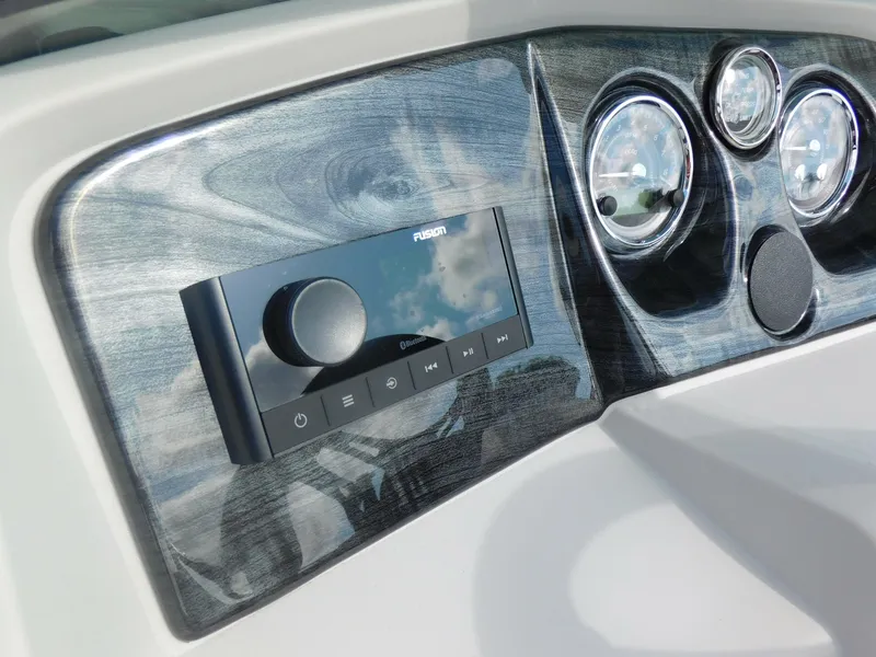 Slide: The Image of 2024 Avalon LSZ Quad Lounger dashboard with Fusion stereo system and gauges. - 18