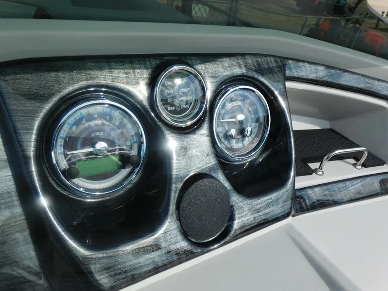 Slide: The Image of 2024 Avalon LSZ Quad Lounger dashboard with gauges and controls. - 19