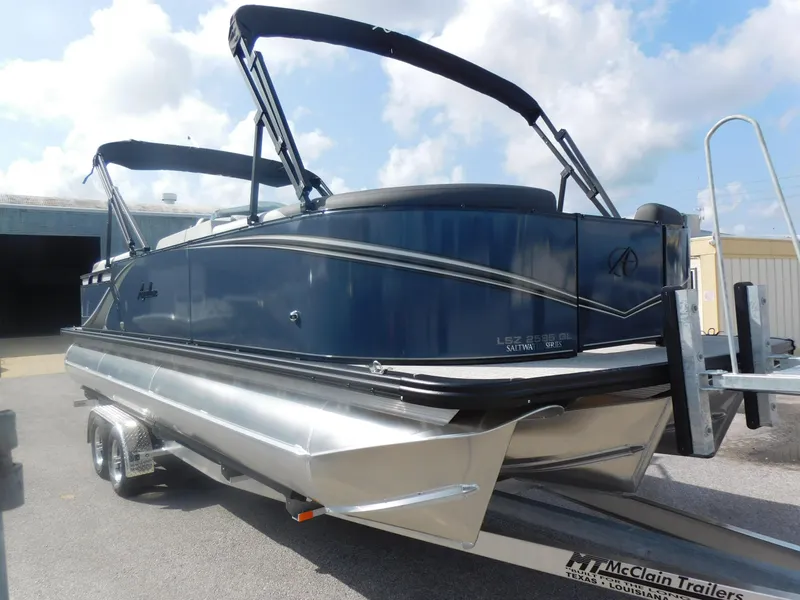 Slide: The Image of 2024 Avalon LSZ Quad Lounger pontoon boat on McClain trailer. - 3