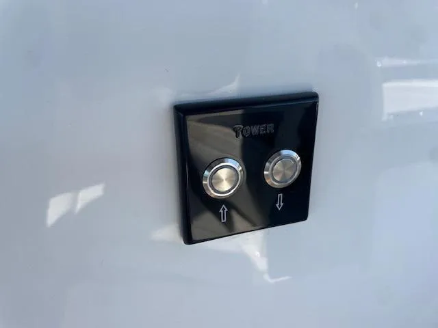 Slide: The Image of Control buttons on the 2024 Sea Ray SLX 260 boat. - 10