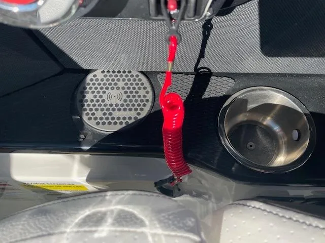 Slide: The Image of Close-up of the 2024 Sea Ray SLX 260 boat's dashboard with cup holder and speaker. - 13