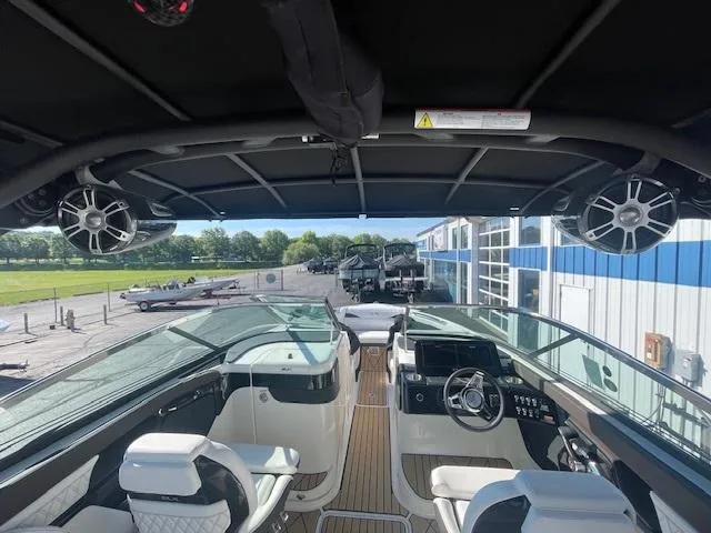 Slide: The Image of 2024 Sea Ray SLX 260 boat interior with modern helm and seating. - 3