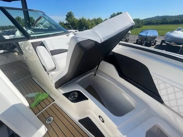 Slide: The Image of 2024 Sea Ray SLX 260 boat interior with open storage compartment. - 5