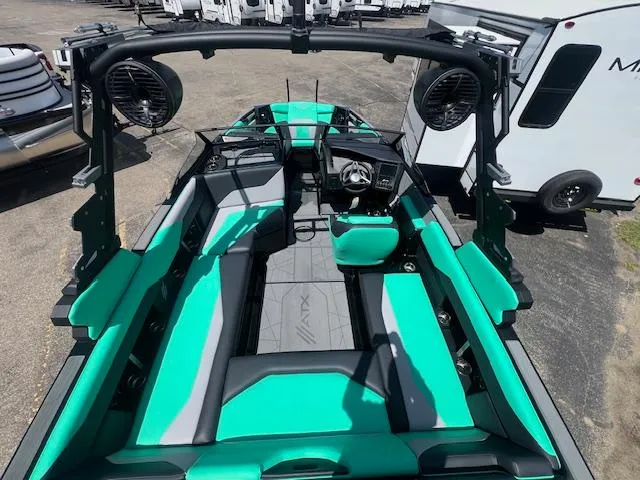 Slide: The Image of 2024 ATX Surf Boats 22 Type-S interior with teal and gray seating. - 10