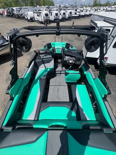 Slide: The Image of 2024 ATX Surf Boats 22 Type-S interior with teal and black seating. - 11