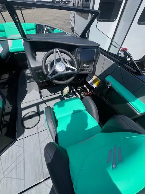 Slide: The Image of Interior of 2024 ATX Surf Boats 22 Type-S with teal seats and modern dashboard. - 12