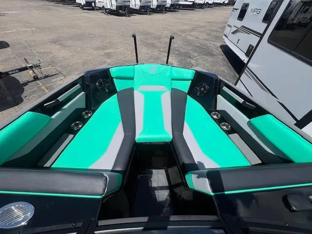 Slide: The Image of 2024 ATX Surf Boats 22 Type-S interior with teal and gray seating. - 14