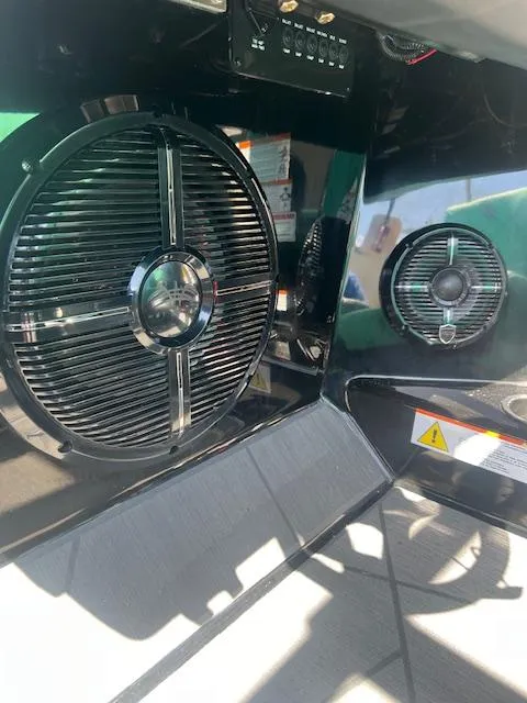 Slide: The Image of 2024 ATX Surf Boats 22 Type-S interior speakers and control panel. - 18