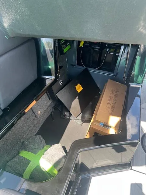 Slide: The Image of 2024 ATX Surf Boats 22 Type-S storage compartment with equipment and accessories. - 19