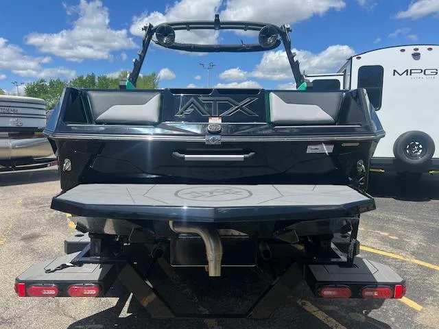 Slide: The Image of 2024 ATX Surf Boats 22 Type-S rear view in parking lot. - 7