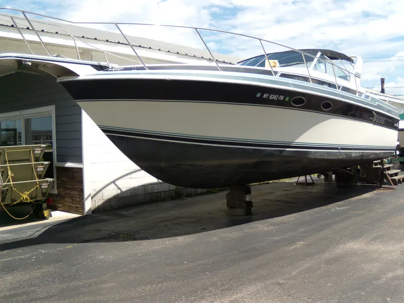 The Image of 1988 Wellcraft St. Tropez 3200 boat on dry dock for maintenance. - 1