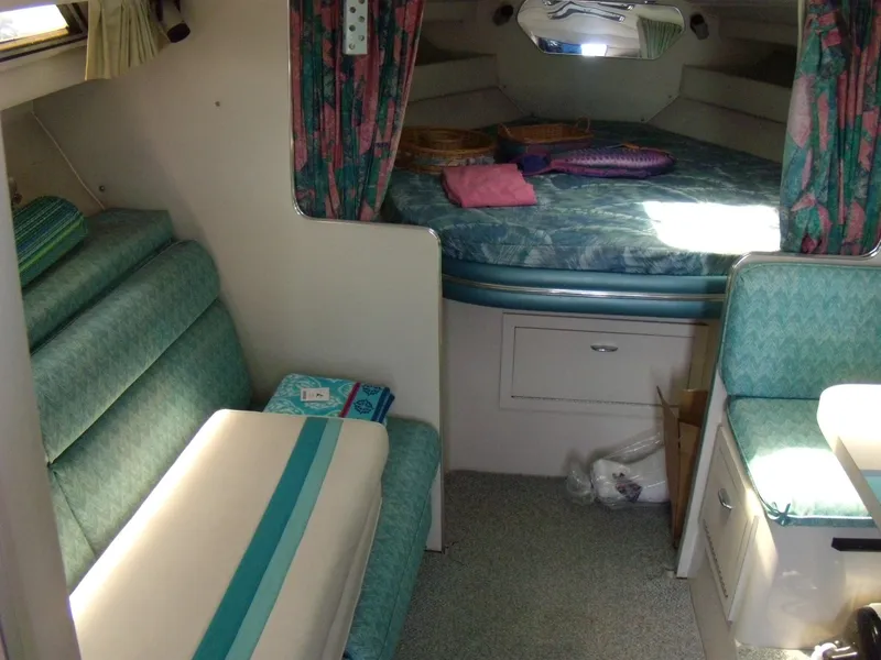 Slide: The Image of Interior cabin of 1988 Wellcraft St. Tropez 3200 with teal and pink decor. - 15