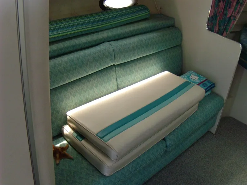 Slide: The Image of Interior seating of 1988 Wellcraft St. Tropez 3200 boat with teal upholstery. - 16