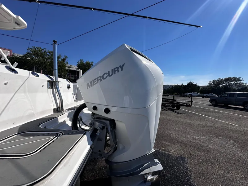 Slide: The Image of 2021 Blackfin 252 DC with Mercury outboard engine in parking lot. - 10