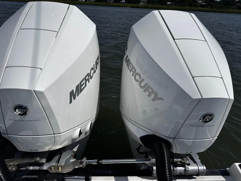 Slide: The Image of Twin Mercury outboard engines on a 2021 Blackfin 252 DC boat. - 11